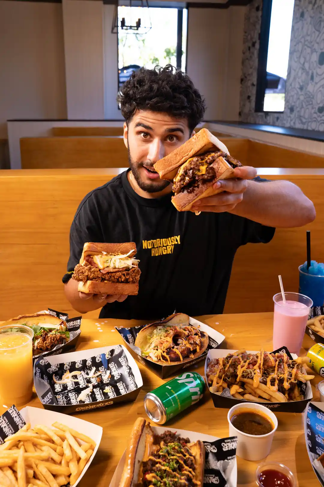 Team member presenting burgers